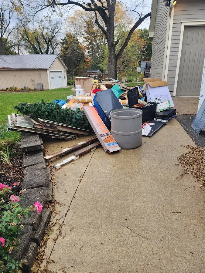 Dumpster being loaded with debris for 3 Yard Dumpster Rental in Summit